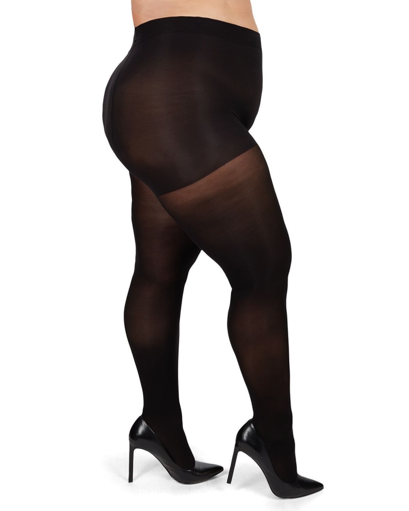 Side of a model wearing a size 5X-6X Microfiber Opaque Plus Size Curvy Control Top Tights in Black by Memoi. | dia_product_style_image_id:299535